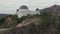 Aerial: Griffith observatory with flight over Hollywood Hills on Cloudy Overcast Day in Los Angeles