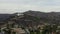 AERIAL: Griffith Observatory with flight over Hollywood Hills in Daylight, Los Angeles, California, Cloudy