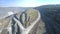 Aerial ground roads for trucks meander around asbestos pit