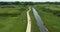 Aerial of a group of bicycle riders along a nature trail in summer