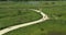 Aerial of a group of bicycle riders along a nature trail in summer