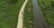 Aerial of a group of bicycle riders along a nature trail in summer