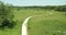 Aerial of a group of bicycle riders along a nature trail in summer