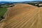 Aerial of hay bales, rolls in an agricultural field