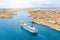 Aerial height view of Malta Valletta and Birgu, floating sailing passanger cruise liner ship to the Great Bay