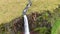 Aerial high angle view of a huge waterfall in Iceland, drone video