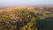 Aerial high angle view of a small village in Transylvania in autumn colors