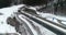 aerial of highway in alpine winter landscape with tunnels