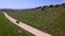 Aerial Of The Hilly Road With Driving Lonely Car