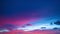 Aerial hyper lapse colorful pink cloud in the blue sunset.