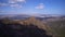 Aerial hyperlapse of spring Siberian city Krasnoyarsk Russia. Rocks and forest in the Pillars National Nature Park with