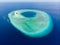 Aerial idyllic atoll, scenic travel destination Maldives Polinesia. Blue lagoon and turquoise coral reef. Shot in Wakatobi