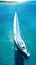 Aerial image of beautiful sailboat cruising in blue open ocean. Luxury white yacht. Generative AI