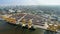 Aerial image of cargo ships at seaport with city view