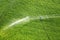 An aerial image of a center pivot sprinkler irrigating farmland.