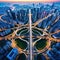 aerial image of a circle roundabout road in an Asian metropolis carrying aerial drone view flying in a circle at a