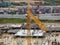 An aerial image of the construction site where the showing site progress is ongoing progressively during the daytime.