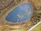 Aerial image of a pond with floating turf mats,