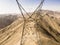 Aerial image of power line tower in Lima Peru. desert hills of the andes.