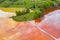 Aerial image of red polluted mining water residuals