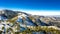An aerial image of the summit of Mt. Lemmon outside of Tucson, Arizona covered in snow