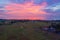 Aerial from an incredible sunset from rice fields and indian ocean at the west coast from Bali in Indonesia