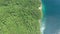 Aerial, island and forest by ocean in nature beach, land mapping and travel of tropical paradise. Sea, indonesia and