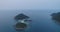 Aerial Island Group In Open Ocean Seascape View. Rocky Hills Isle Sea Ripples Bold Shore Covered