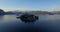 Aerial: Isola Bella on Lago Maggiore lake with mountains landscape, Italy