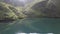 Aerial of lake in spring valley Caucasus mountains Arkhyz Russia