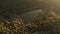 Aerial of a lake sun light and forest