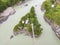 Aerial of a landmark in the Altai Territory Patmos Island with a monastery church and a suspended wooden bridge