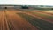 Aerial landscape, agricultural fields in the harvesting season.