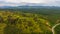 Aerial landscape of Borneo Forest and palm tree plantation. beautiful peatland forest landscape with the dirt road on the side