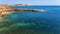 Aerial, landscape of the cliff that is washed by the Pacific Atlantic Ocean, with quiet, calm, blue waves. Portugal.