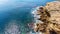 Aerial, landscape of the cliff that is washed by the Pacific Atlantic Ocean, with quiet, calm, blue waves. Portugal.