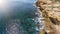 Aerial, landscape of the cliff that is washed by the Pacific Atlantic Ocean, with quiet, calm, blue waves. Portugal.