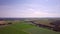 Aerial Landscape: of the countryside, over farmland, with blue and purple sky