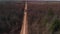 Aerial Landscape of Dirt Road and Woods in Spring Time