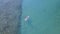 Aerial landscape of people kayaking on the sea