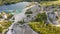 Aerial landscape Sand Hills of Quarry With a Pond and Abandoned Prison in Rummu Estonia Europe.