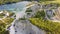 Aerial landscape Sand Hills of Quarry With a Pond and Abandoned Prison in Rummu Estonia Europe.