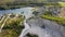 Aerial landscape Sand Hills of Quarry With a Pond and Abandoned Prison in Rummu Estonia Europe.