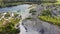 Aerial landscape Sand Hills of Quarry With a Pond and Abandoned Prison in Rummu Estonia Europe.