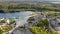 Aerial landscape Sand Hills of Quarry With a Pond and Abandoned Prison in Rummu Estonia Europe.