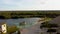 Aerial landscape Sand Hills of Quarry With a Pond and Abandoned Prison in Rummu Estonia Europe.