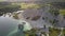 Aerial landscape Sand Hills of Quarry With a Pond and Abandoned Prison in Rummu Estonia Europe.