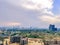 Aerial landscape shot showing gurgaon landscape with dusk sunlight and clouds, unfinished under construction buildings