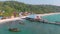 Aerial Landscape of Sok San village with pier, boats, transparent water and nature in Koh Rong Island in Cambodia
