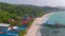 Aerial Landscape of Sok San village with pier, boats, transparent water and nature in Koh Rong Island in Cambodia